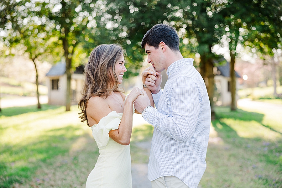 kiss on the hand at sequoyah hills spring engagement