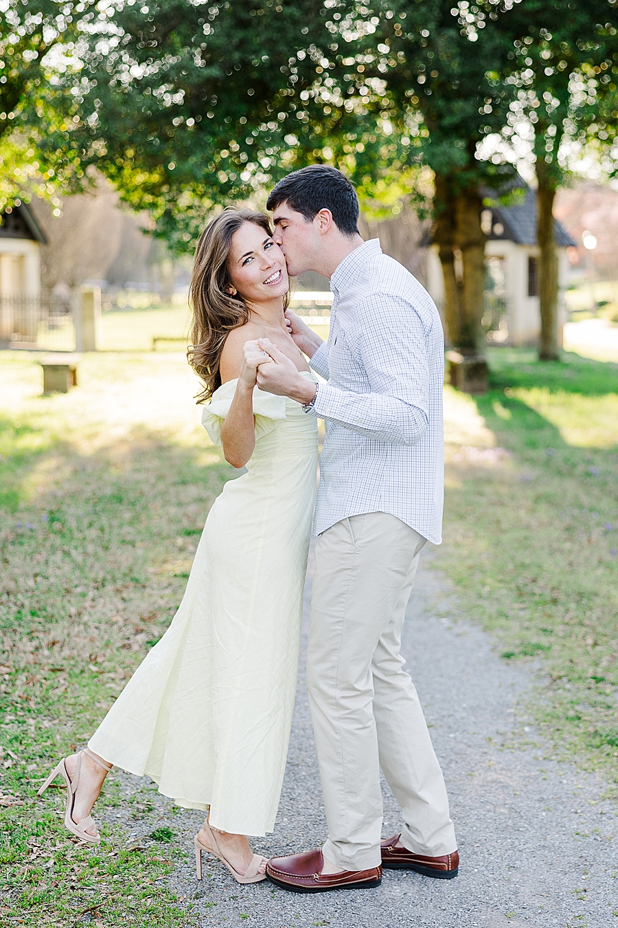 kiss on the cheek at sequoyah hills spring engagement