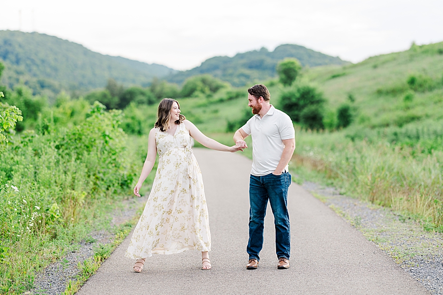 pregnant couple dancing during session