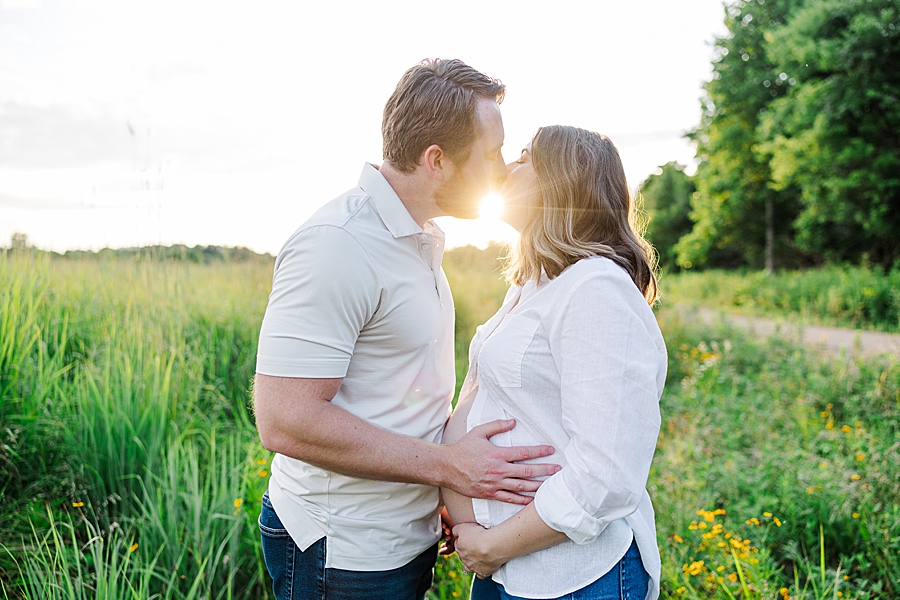 couple kissing during golden hour