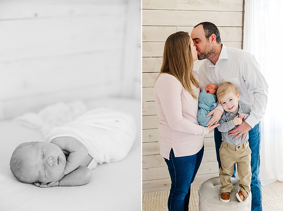 parents kissing during sibling newborn session