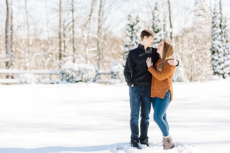 engaged couple at snowy castleton