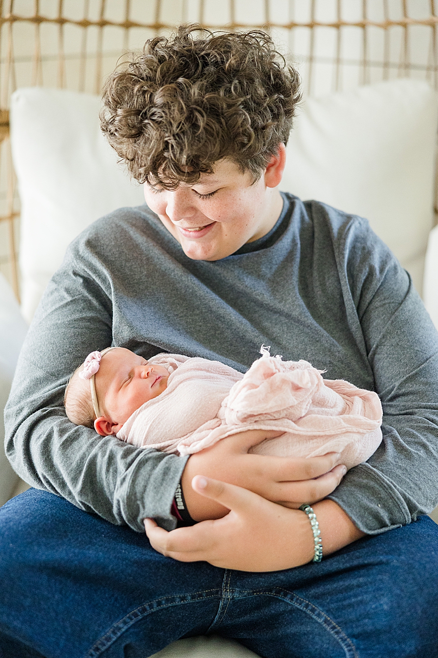 brother holding sister at studio newborn