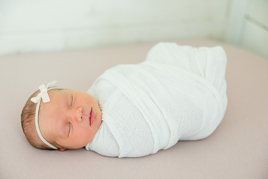 swaddled baby girl at studio newborn