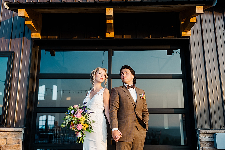 Bride and groom holding hands at styled shoot by Amanda May Photos