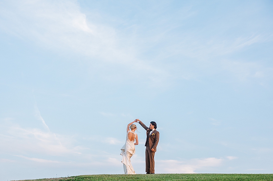 Groom spinning bride at styled shoot by Amanda May Photos