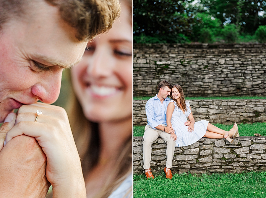 couple sitting on stone wall at summer engagement