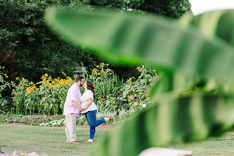 kissing during summer ut gardens engagement