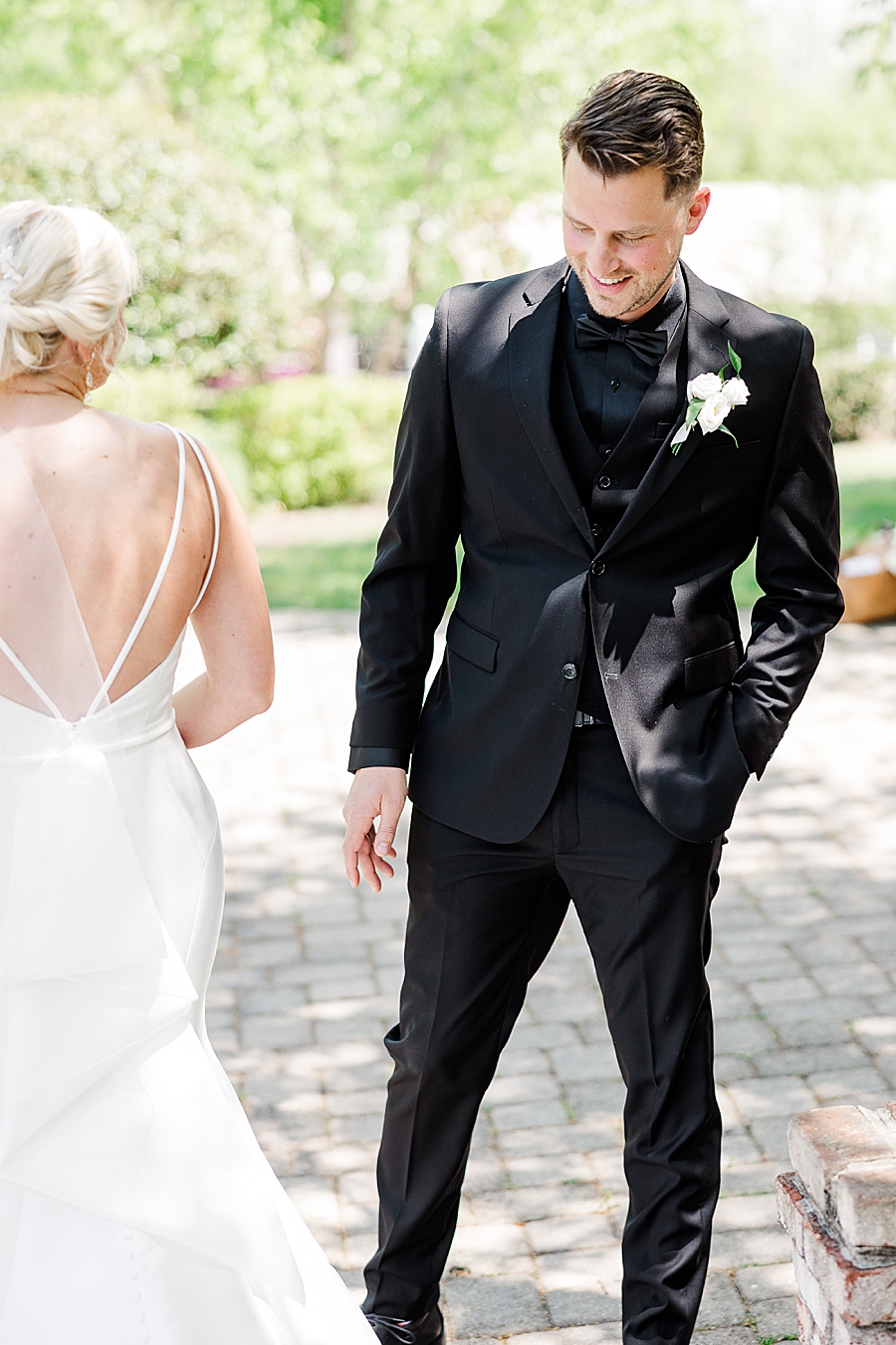 groom checking out bride's dress