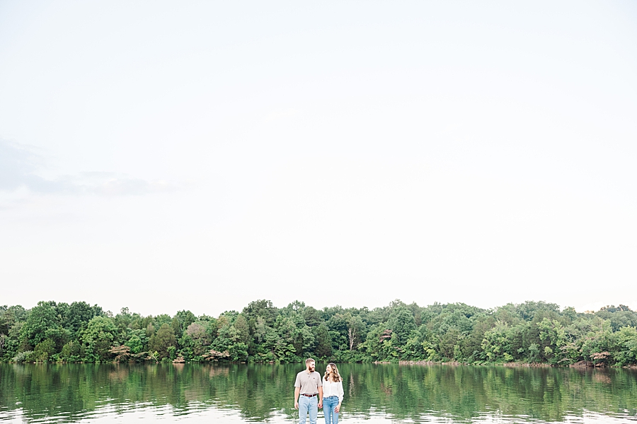 couple by large pond