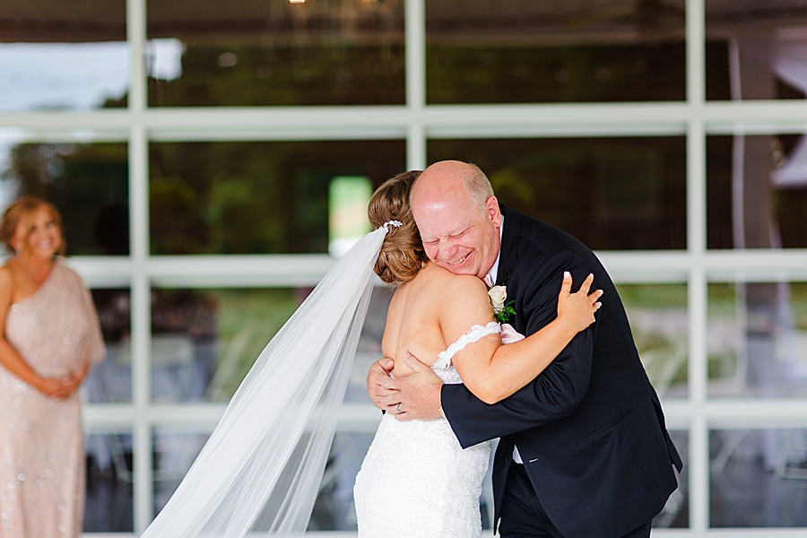 bride hugging dad at the carriage house