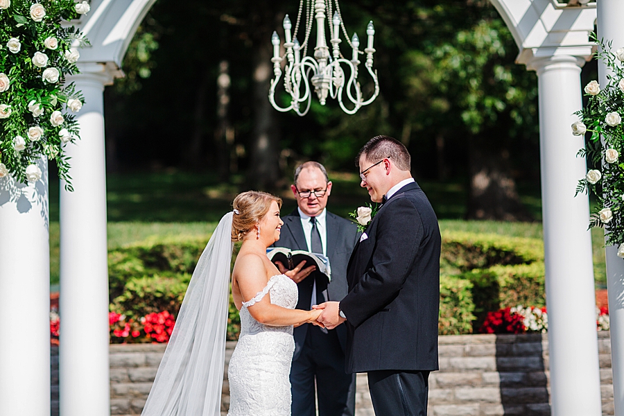 exchanging vows at the carriage house