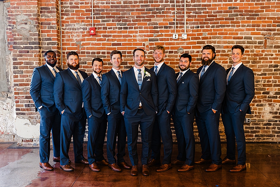 groom and groomsmen at the press room
