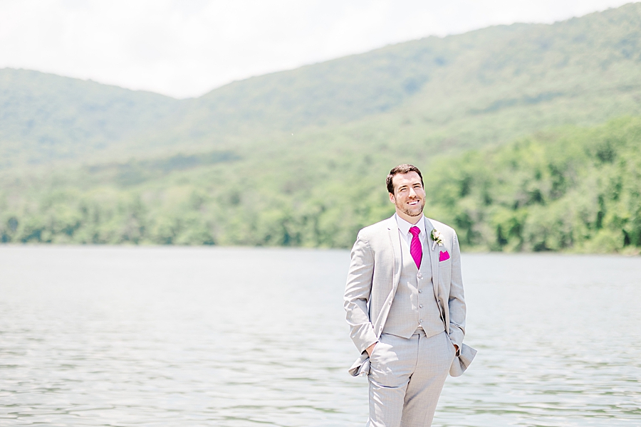groom standing by the tennessee river