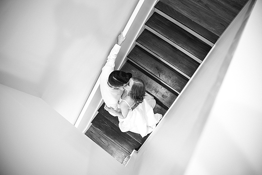 couple kissing on stairs at the trillium venue