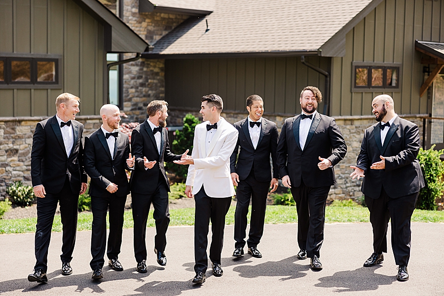 groom and groomsmen walking outside