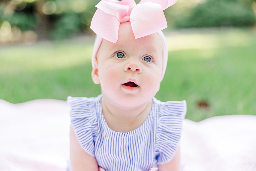 baby girl in big pink bow
