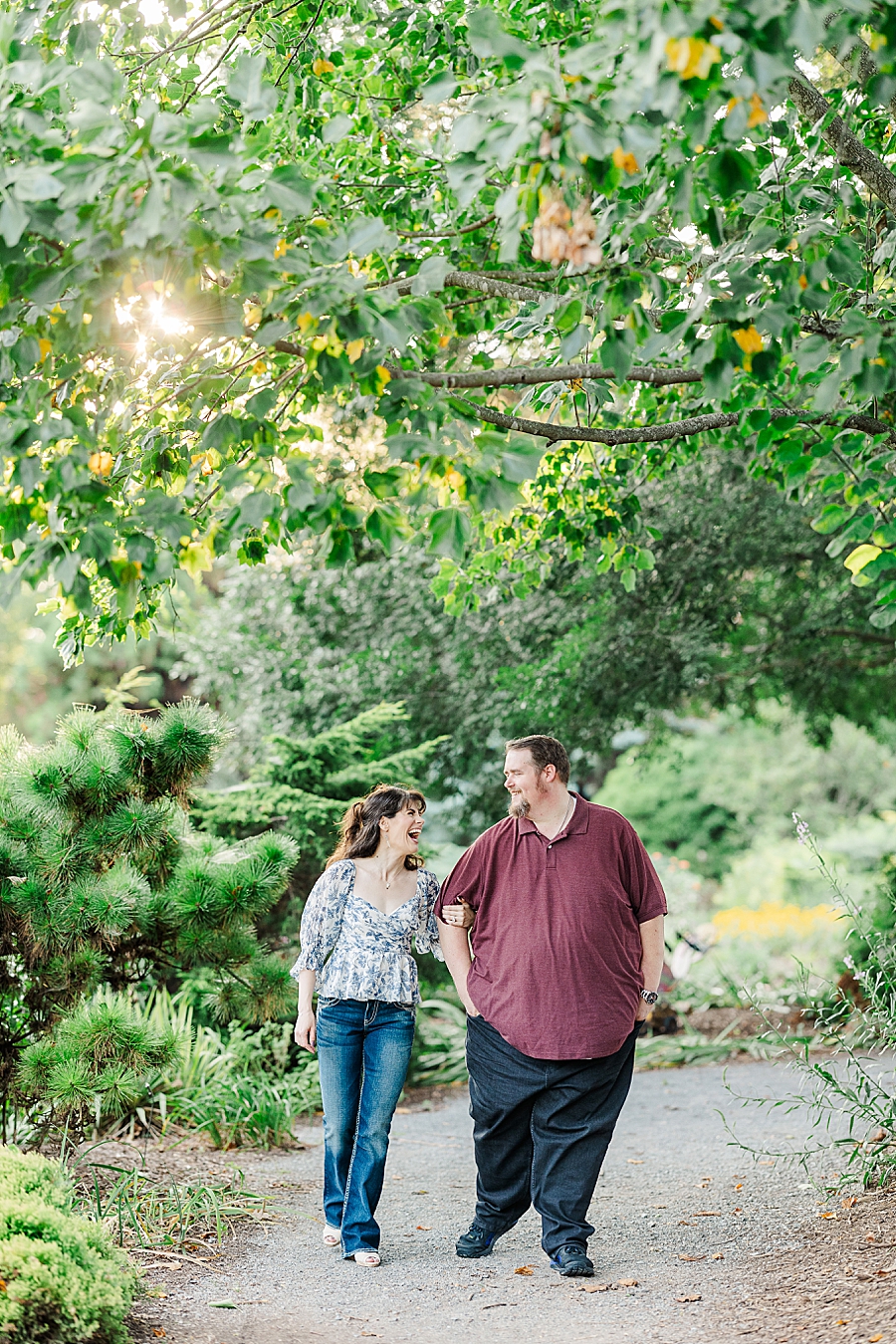 couple laughing during ut gardens engagement