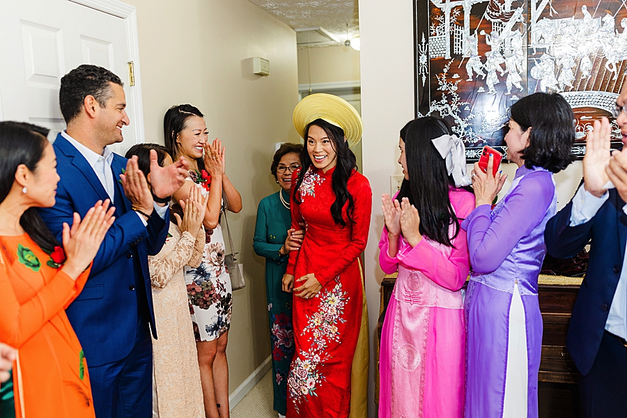 guests clapping at this vietnamese wedding