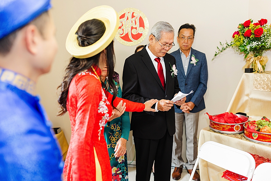 reading a letter at this vietnamese wedding