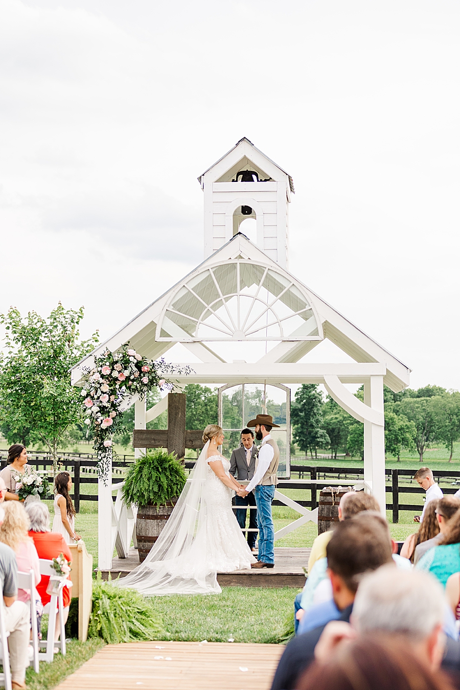 exchanging vows at vintage barn
