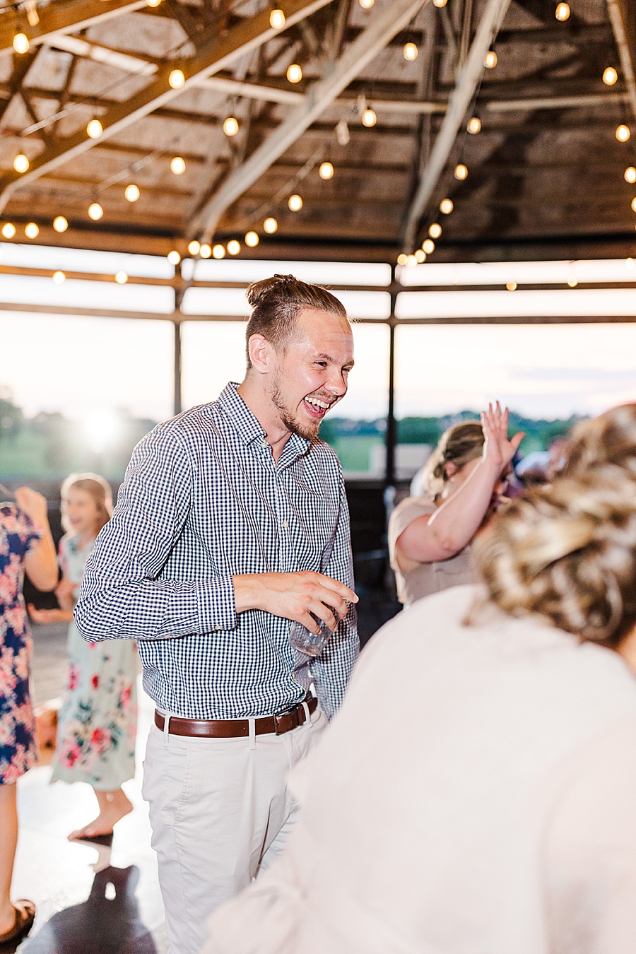 guests dancing at vintage barn reception