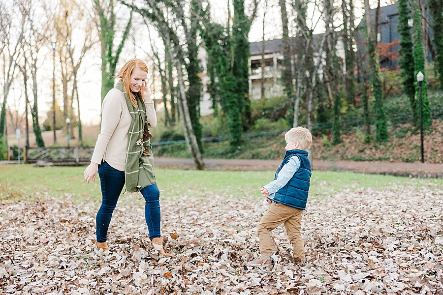 playing in leaves at fall family session