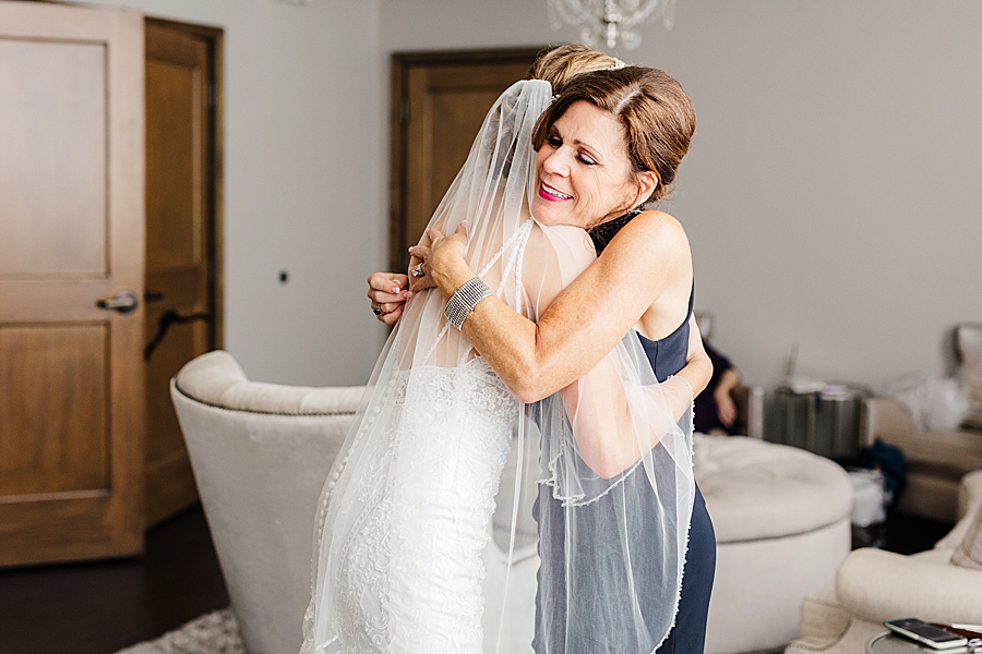bride hugging mother at a wedding at the press room