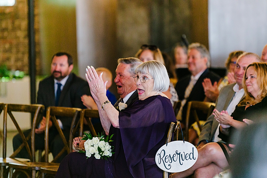 guests clapping at a wedding at the press room