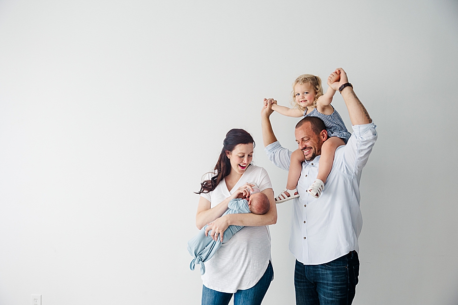 family of 4 at white room baby boy session