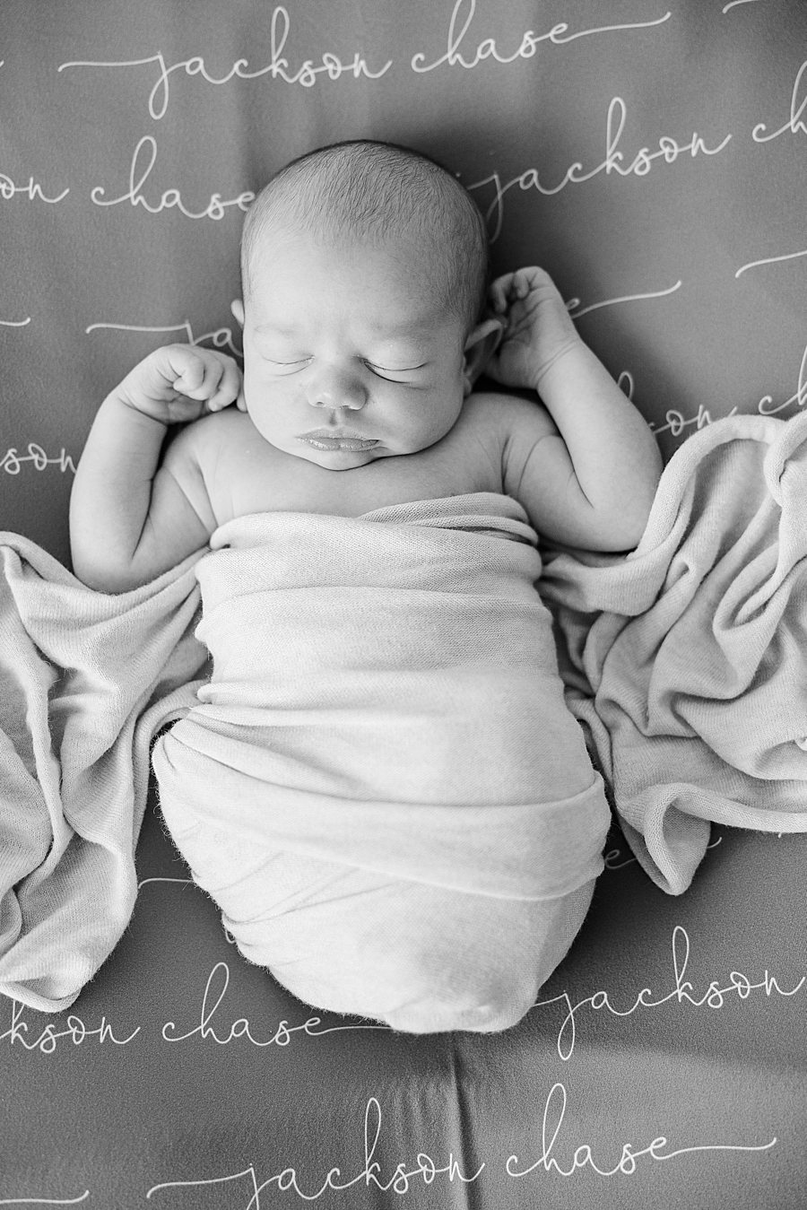 swaddled newborn at white room baby boy session