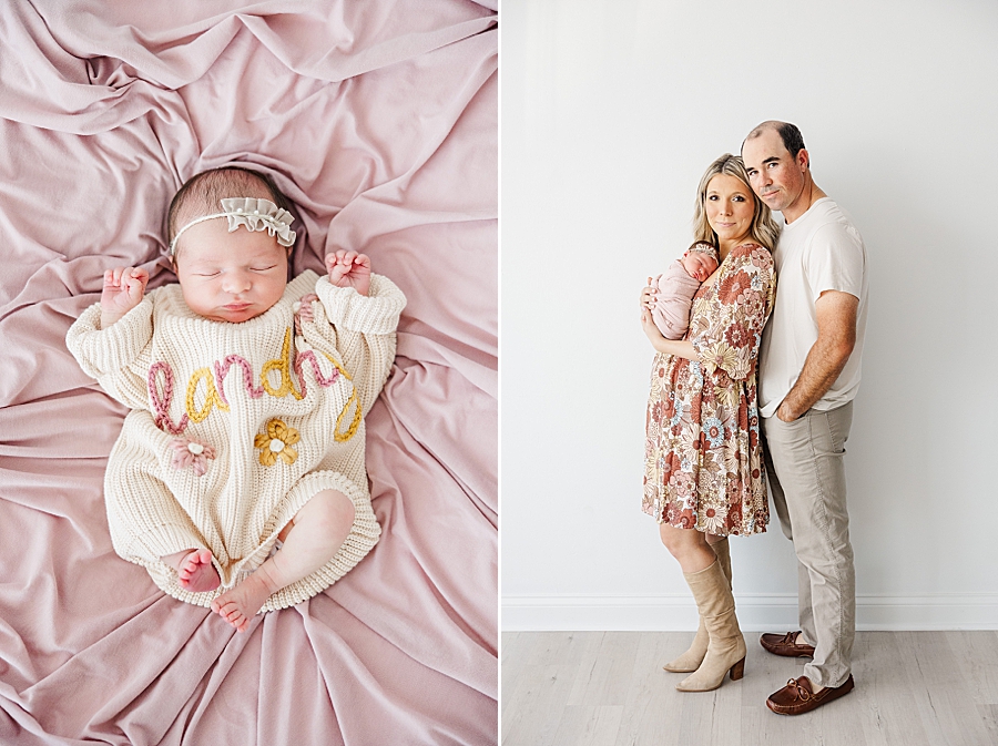 newborn in personalized sweater at white room session