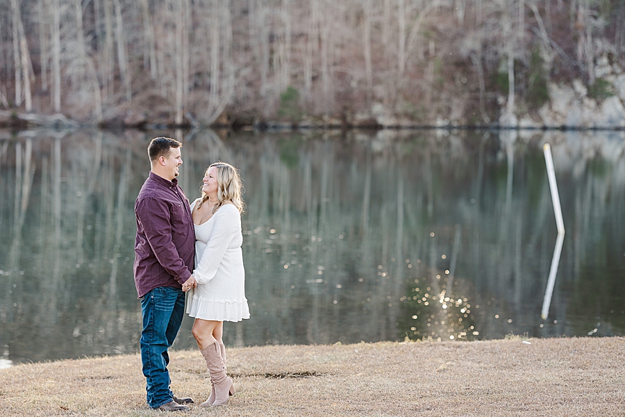 couple by river at winter melton hill engagement