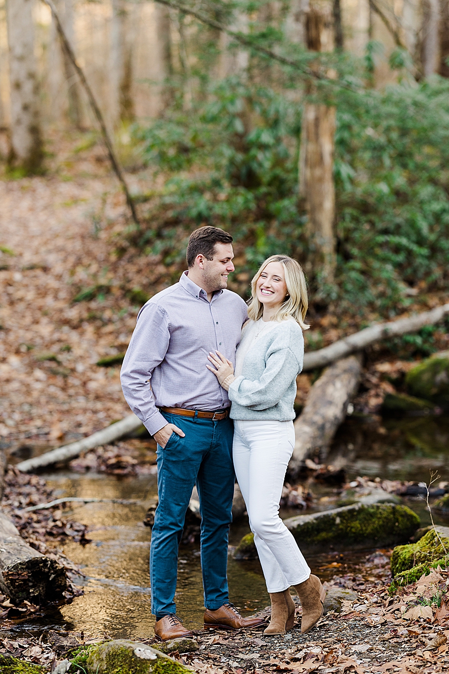 couple standing in woods