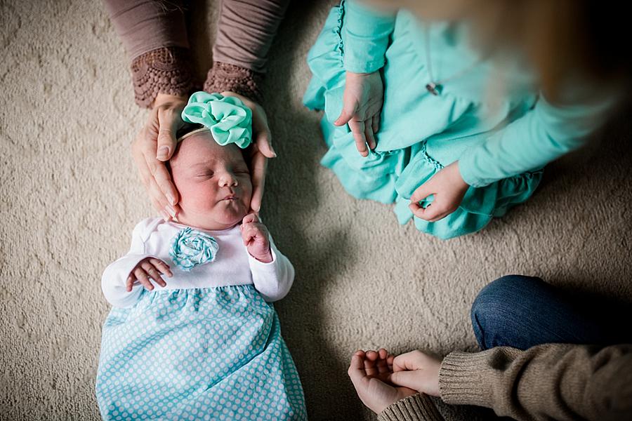 Moms hands around baby's hands at this lifestyle family session by Knoxville Wedding Photographer, Amanda May Photos.