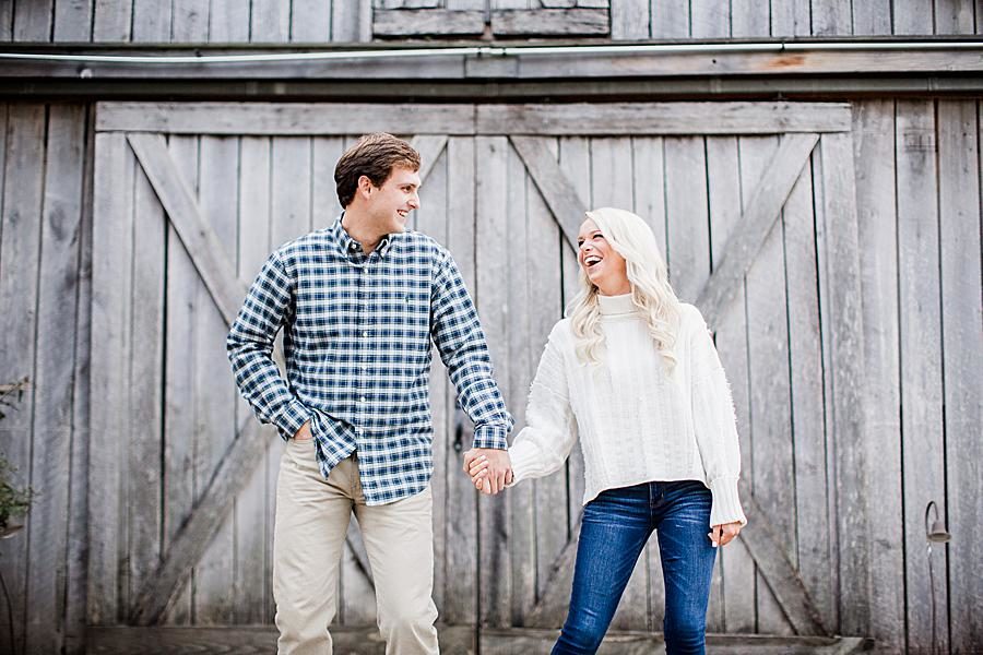 Holding hands at this Castleton Farms Engagement by Knoxville Wedding Photographer, Amanda May Photos.