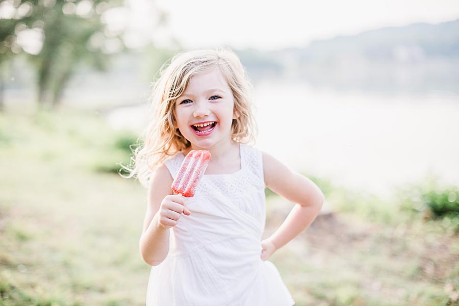 Eating a red popsicle at this Concord Park Family by Knoxville Wedding Photographer, Amanda May Photos.