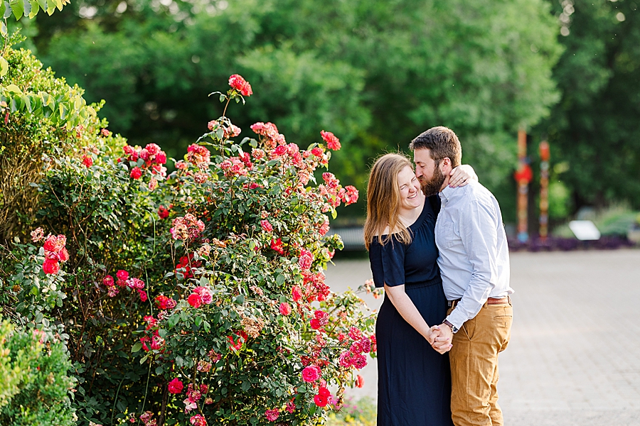 Whispering in her ear at UT Gardens Engagement by Amanda May Photos 