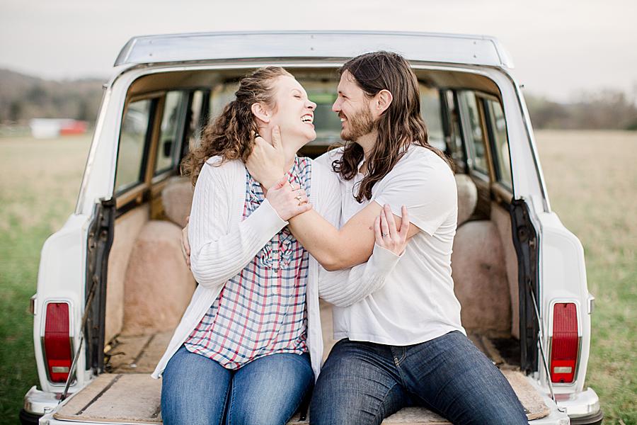 Long hair fiance at this Farm Engagement Session by Knoxville Wedding Photographer, Amanda May Photos.