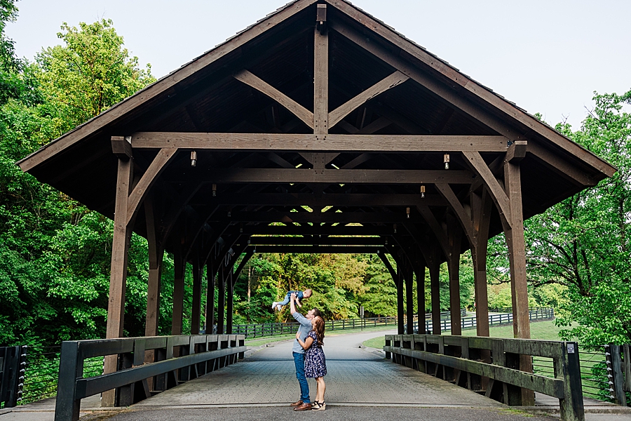 Lifting baby in the air at Covered Bridge Family Session by Amanda May Photos 