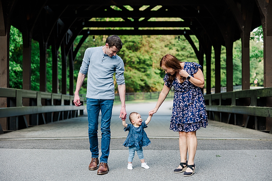 Holding hands with baby at Covered Bridge Family Session by Amanda May Photos 