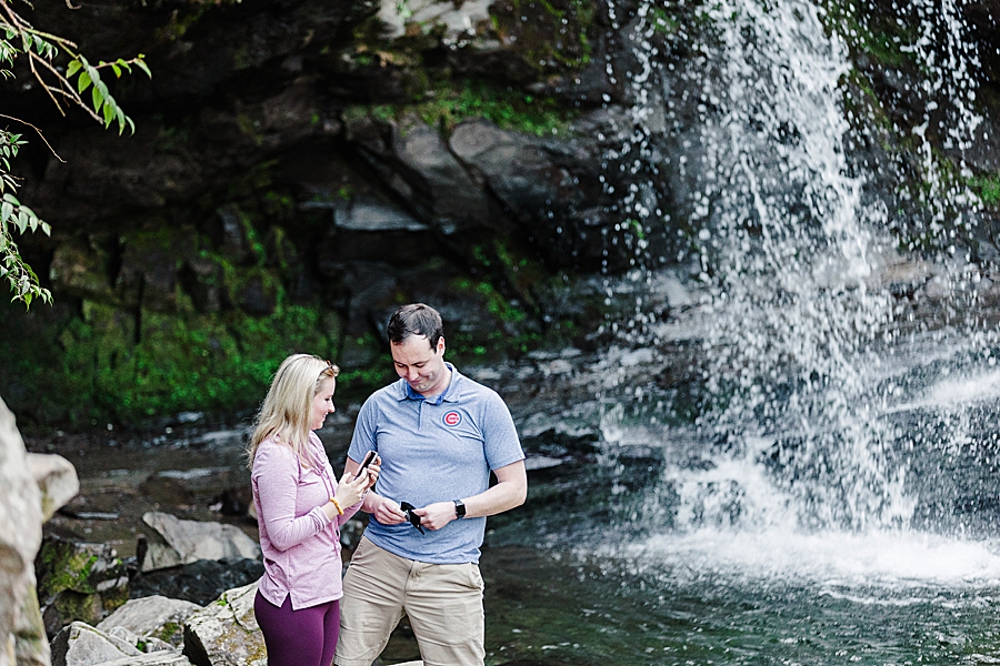 posting to instagram at grotto falls proposal