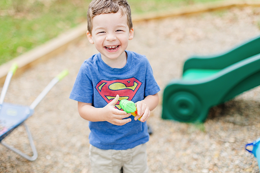 boy in superman shirt at hope resource center mini