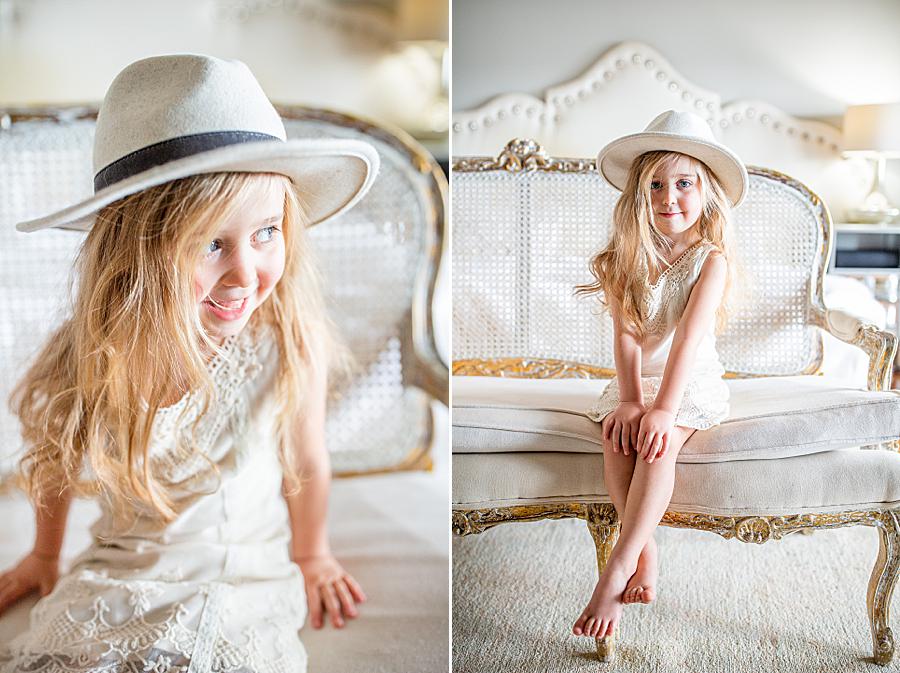 little girl in a hat at lifestyle newborn session