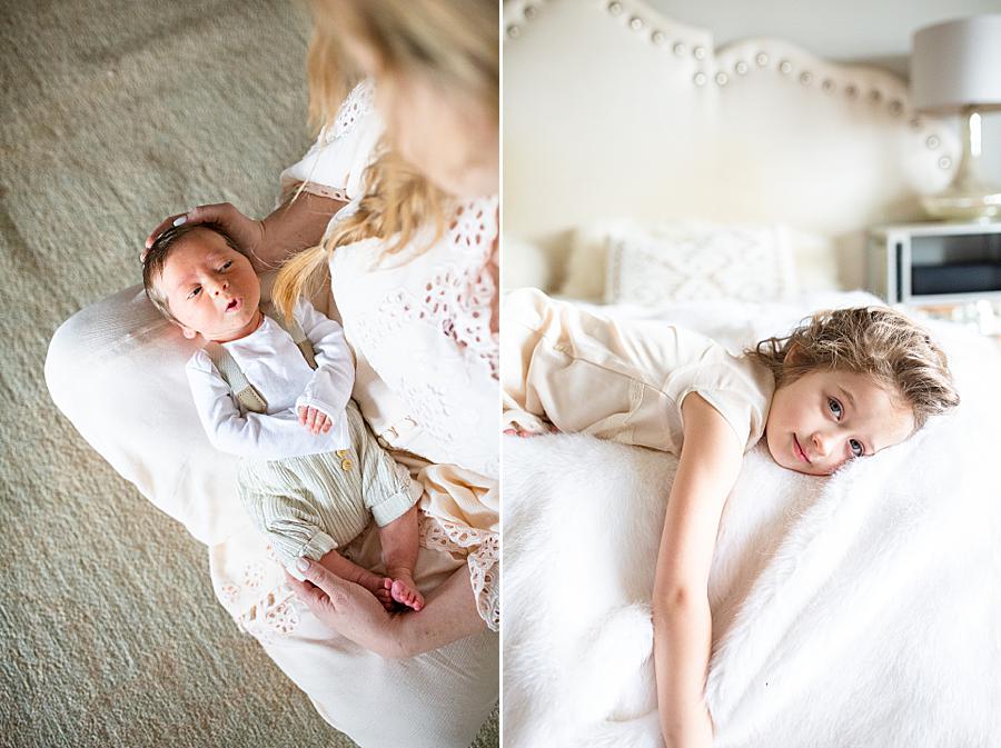 mom holding newborn at lifestyle newborn session