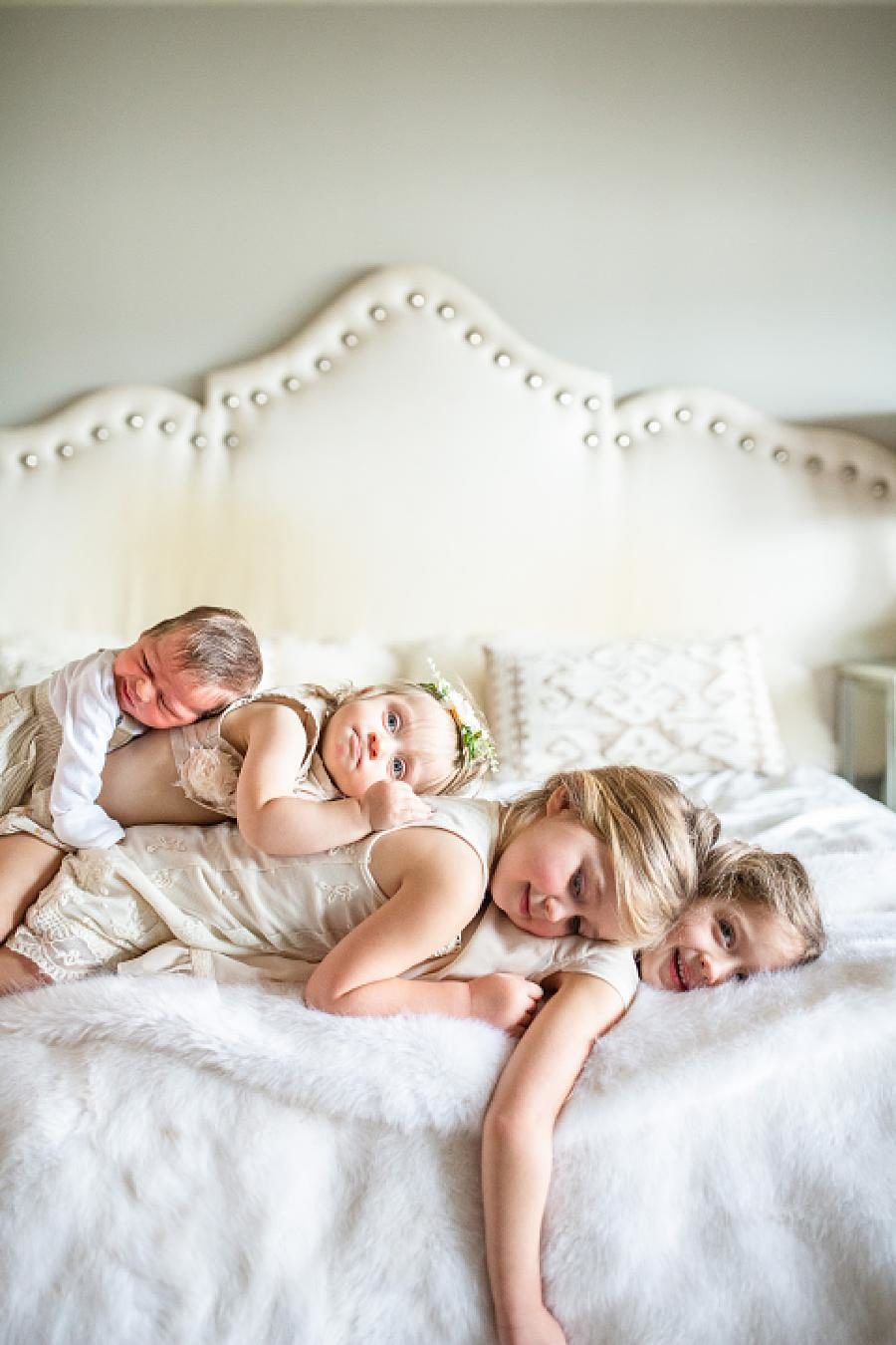 siblings laying on top of each other