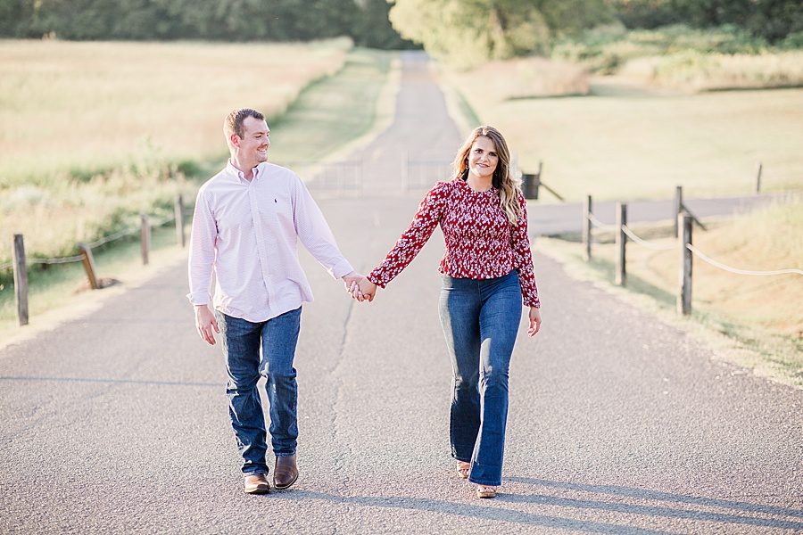 Holding hands at this Melton Hill engagement session by Knoxville Wedding Photographer, Amanda May Photos.