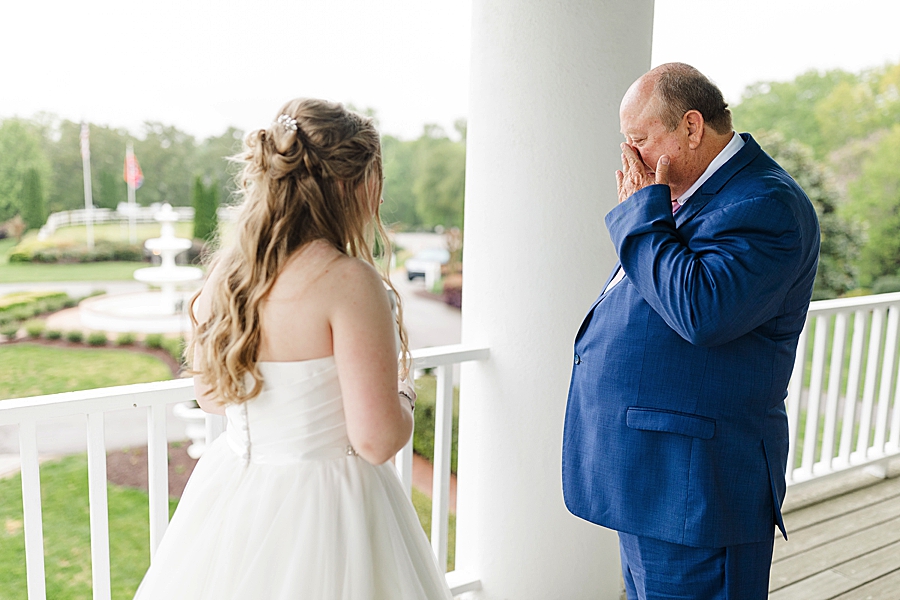 Emotional father of the bride at rainy castleton farms wedding