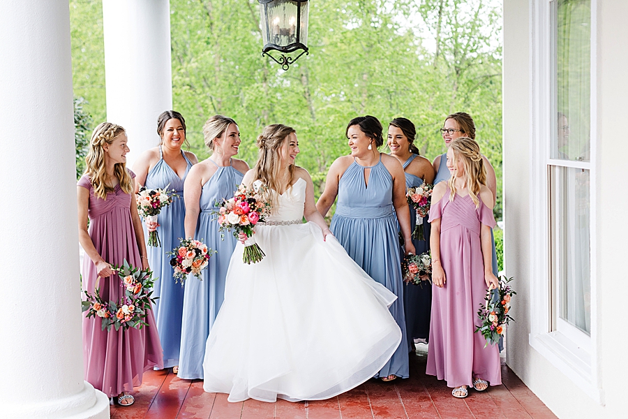 Blue bridesmaid dresses at rainy castleton farms wedding
