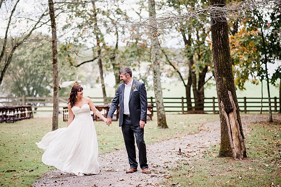 Holding hands at this RiverView Family Farm wedding by Knoxville Wedding Photographer, Amanda May Photos.